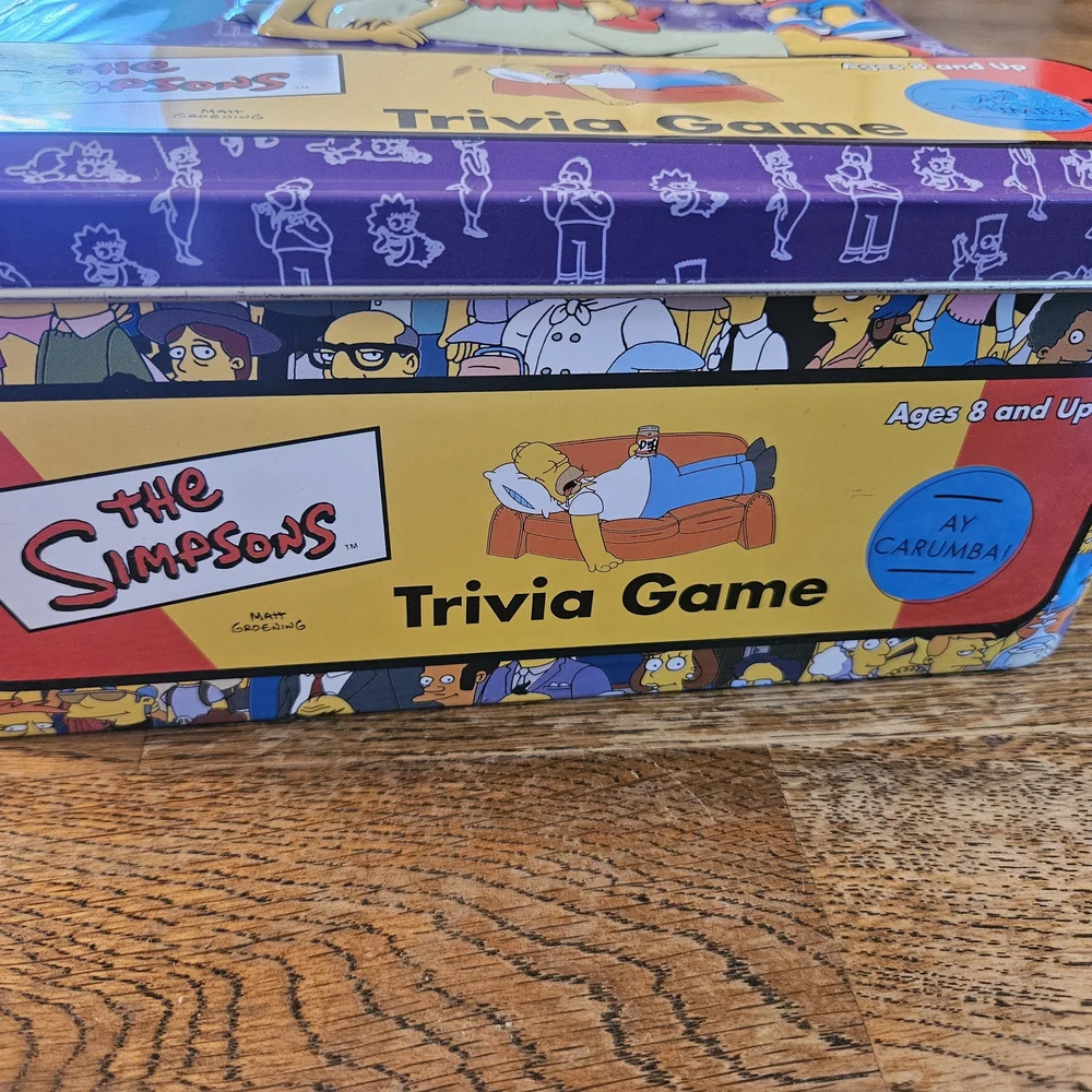 The Simpsons Trivia Game 2000 Board Game in Collectors Tin with Cast Poster